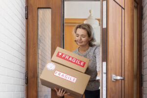 Happy client receiving their delivered moving box – satisfied customer during relocation