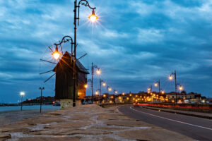 Old windmill at the entrance to Nessebar old town at sunset, Unesco Heritage site, Bulgaria