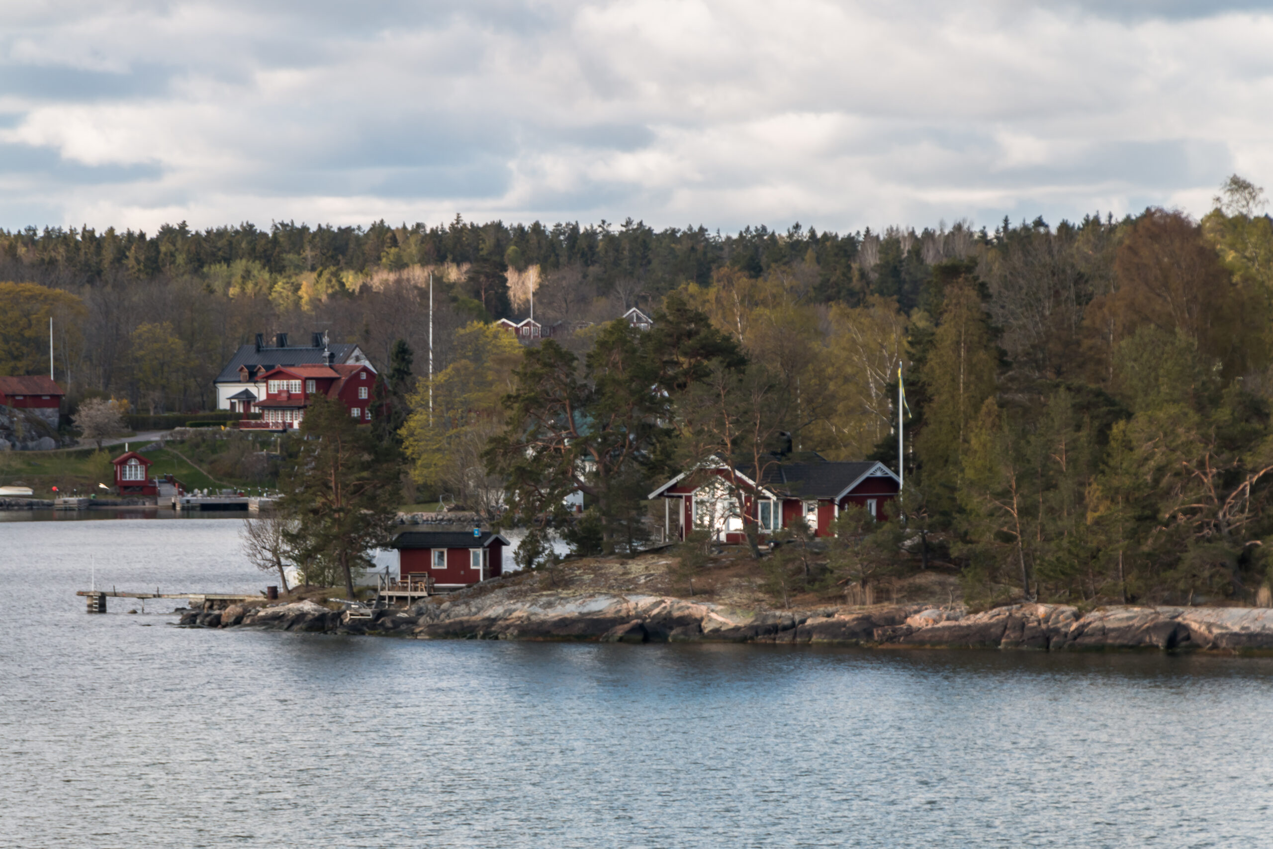 View from the ship to the rocky coast of Sweden – maritime scenery with rugged shoreline