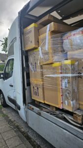 van filled with packed items from netherlands to germany