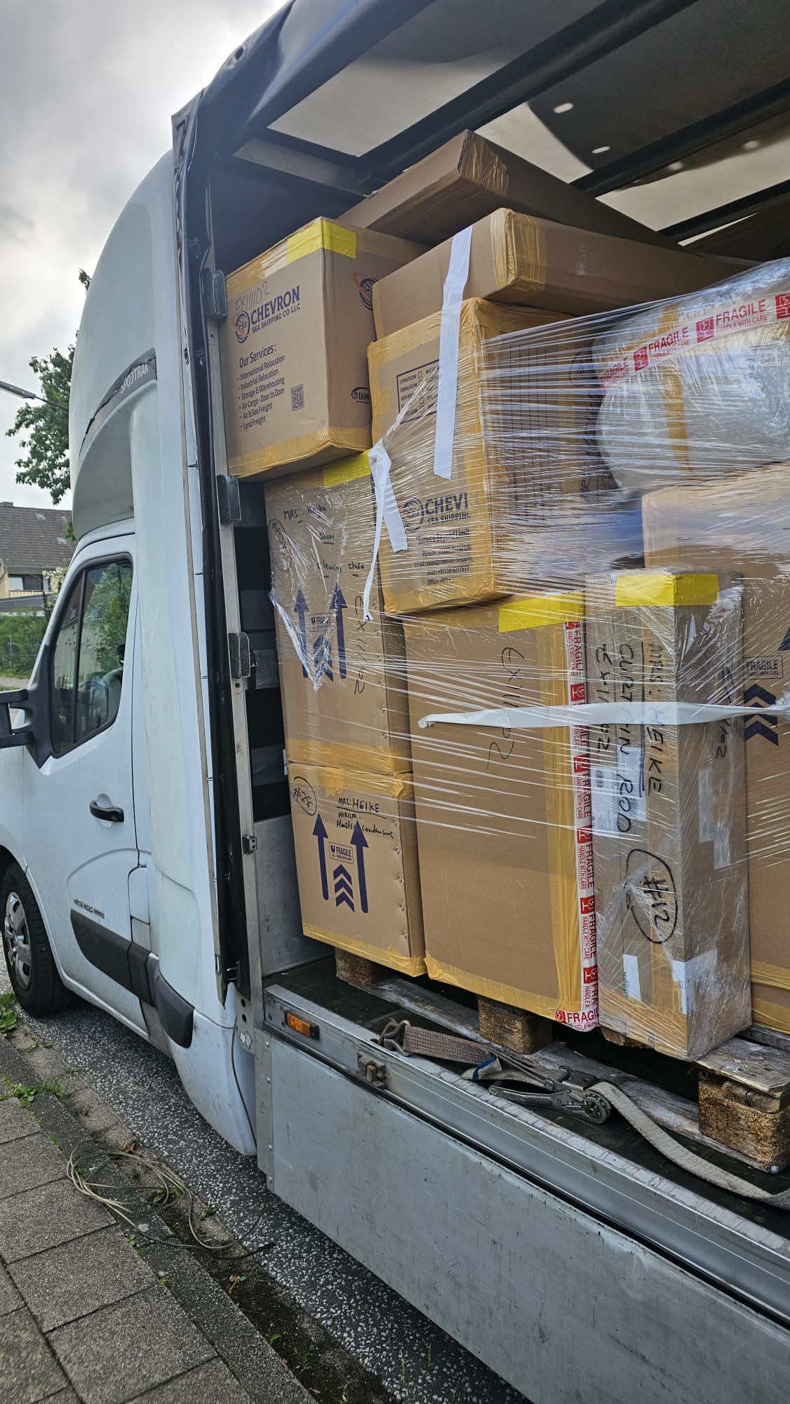 van filled with packed items from netherlands to germany